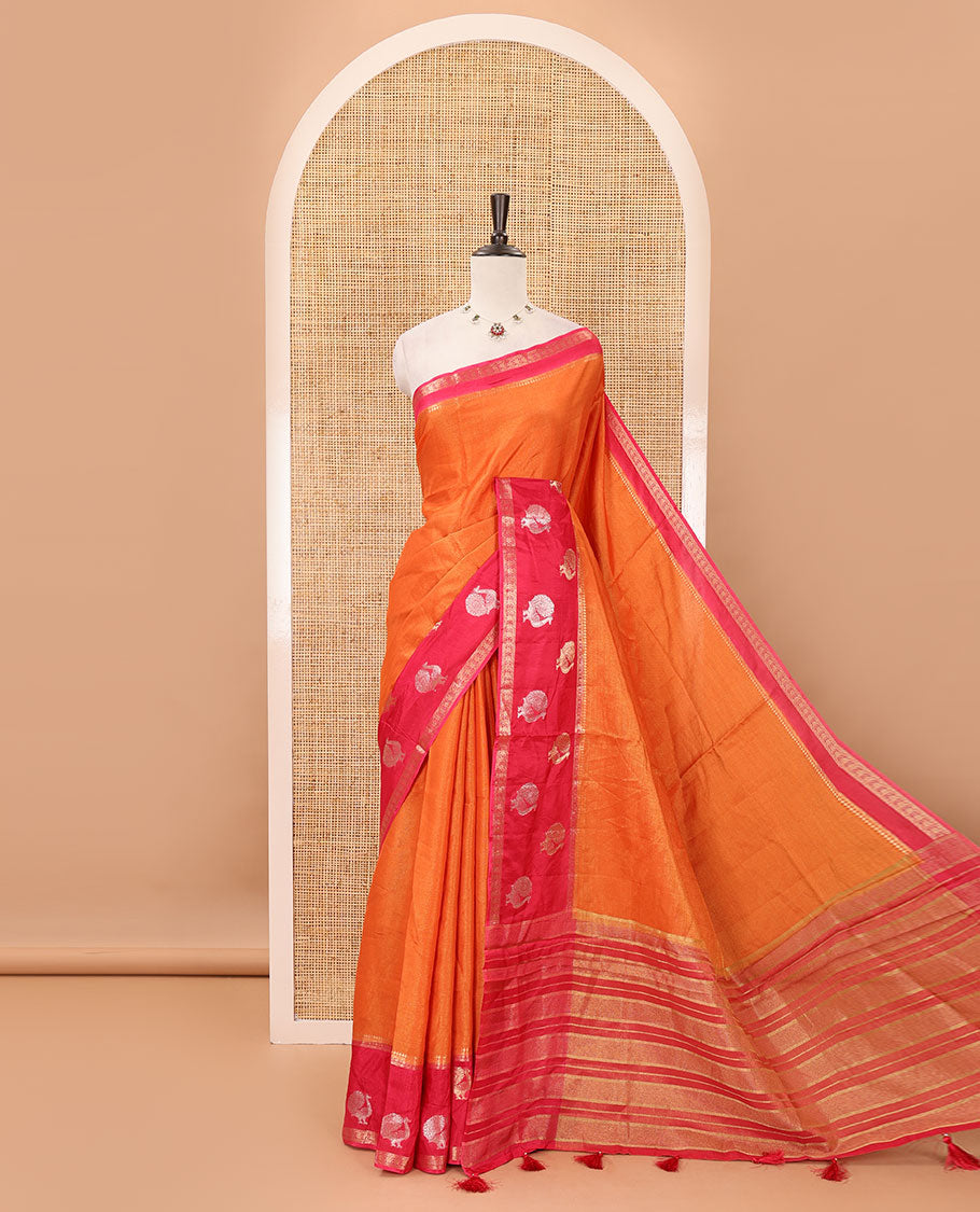 Orange plain Banarasi tissue silk saree, contrast traditional zari peacock border, zari striped pallu & floral jaal jacquard red blouse