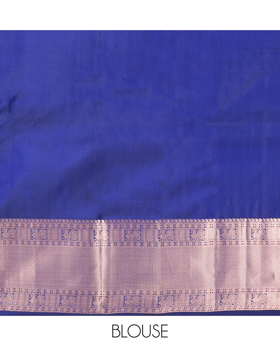 Blue Kanchipuram Silk Saree, Delicately Woven with Zari Buttas and Checked Design All Over Its Body, Highlighted by Zari Border of Manga Mokku, Paisa, Mayil, and Mayil Kann Designs, a Grand Jaal Pallu, and Paired with a Matching Blouse