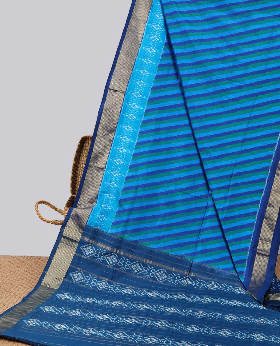 Blue striped ikkat silk saree with contrast zari border & floral design pallu