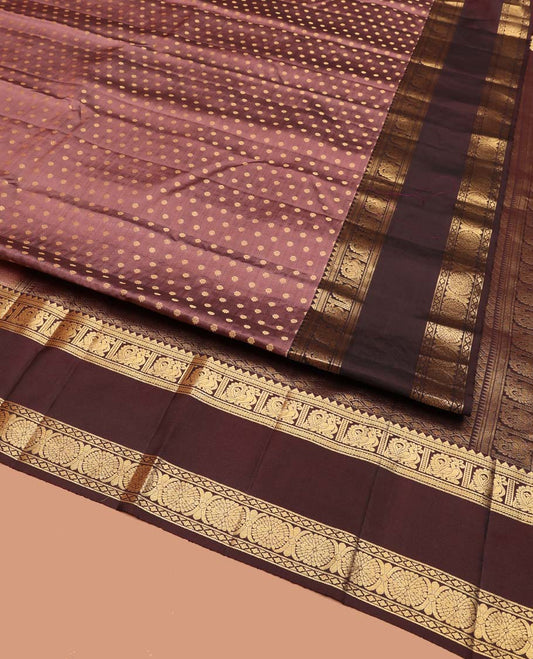 Brown Vasundhara Silk Saree, Beautified with Floral Buttas on Its Body, Complemented by a Contrast Rettai Pettu Border of Rekku, Kathir, Annam Lavangam, and Cross Kamalam Designs, Pallu of Jaal Designs, and Paired with a Contrast Blouse