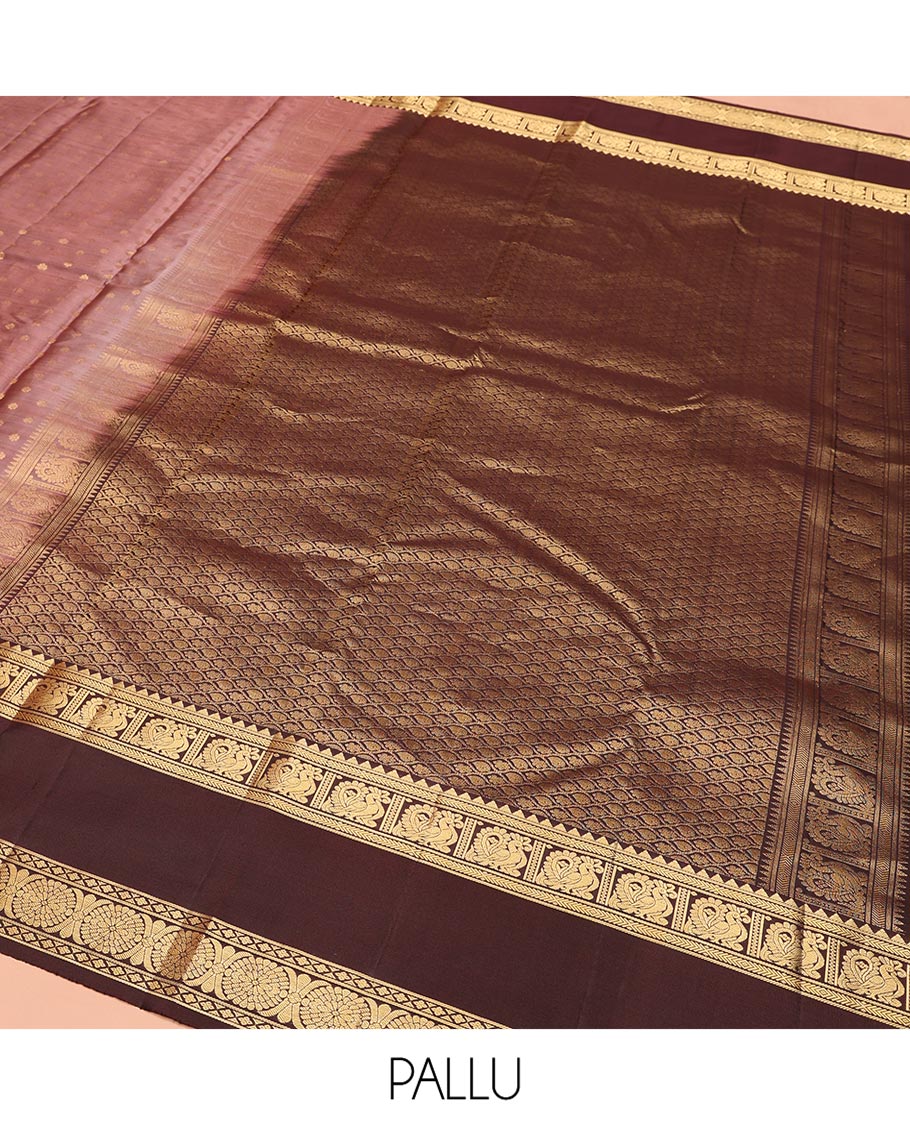 Brown Vasundhara Silk Saree, Beautified with Floral Buttas on Its Body, Complemented by a Contrast Rettai Pettu Border of Rekku, Kathir, Annam Lavangam, and Cross Kamalam Designs, Pallu of Jaal Designs, and Paired with a Contrast Blouse