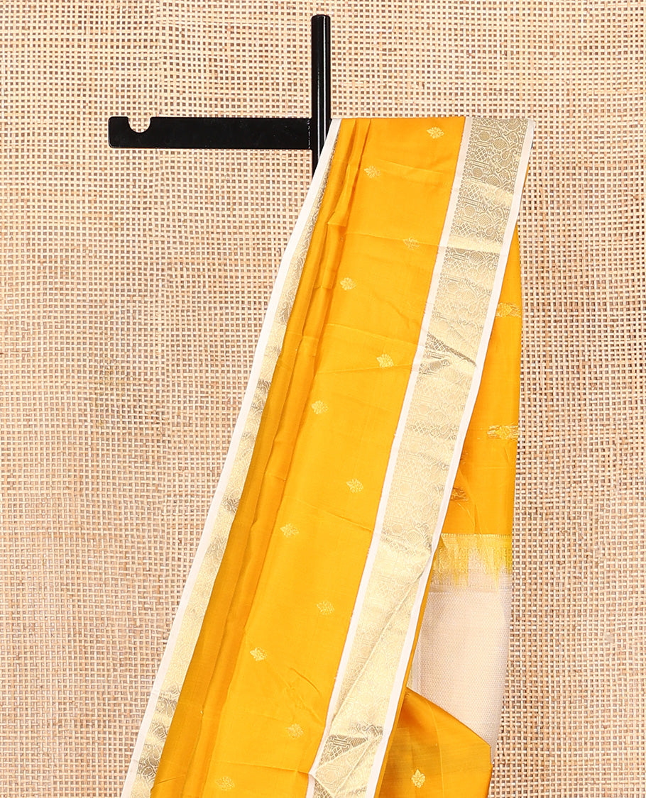 Yellow zari buttas Vasundhara silk mix saree, contrast border of rudraksham and mayil designs, and zari-rich pallu