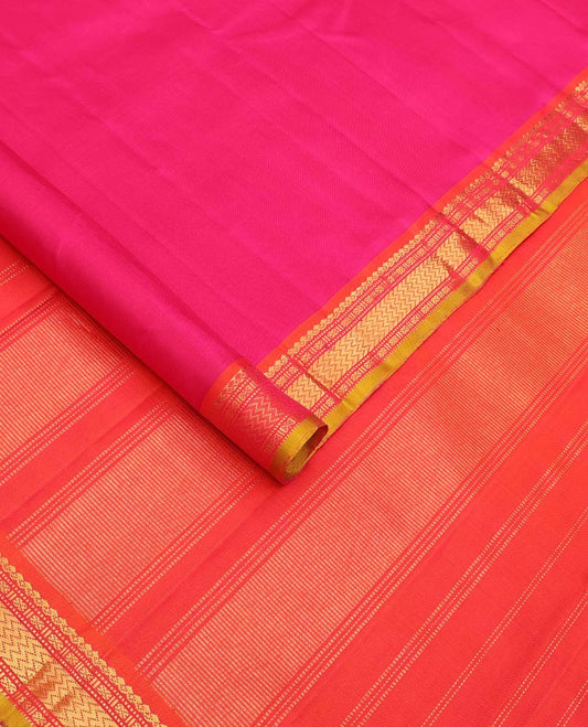 Pink plain Kanchipuram silk saree, contrast border of salngai, muthu, cross kamalam, and vanki designs, and zari design pallu