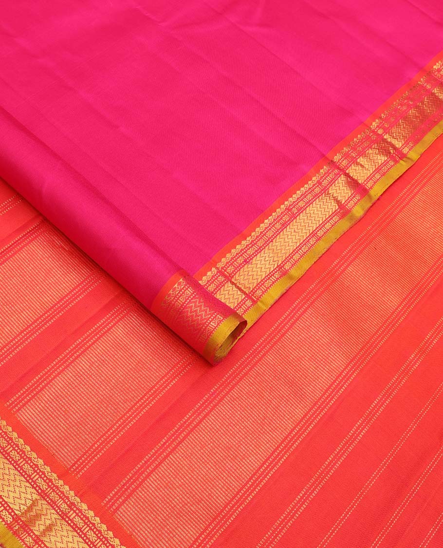 Pink plain Kanchipuram silk saree, contrast border of salngai, muthu, cross kamalam, and vanki designs, and zari design pallu