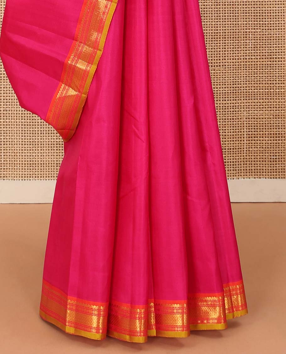 Pink plain Kanchipuram silk saree, contrast border of salngai, muthu, cross kamalam, and vanki designs, and zari design pallu