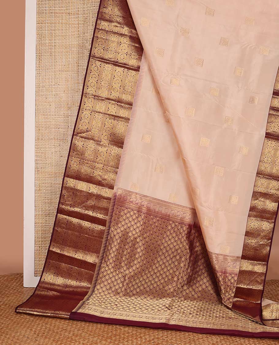 Sandal zari buttas silk saree, contrast border of ara bogudi, jadai nagam, and dhavana kodi, and spade motifs steeped pallu