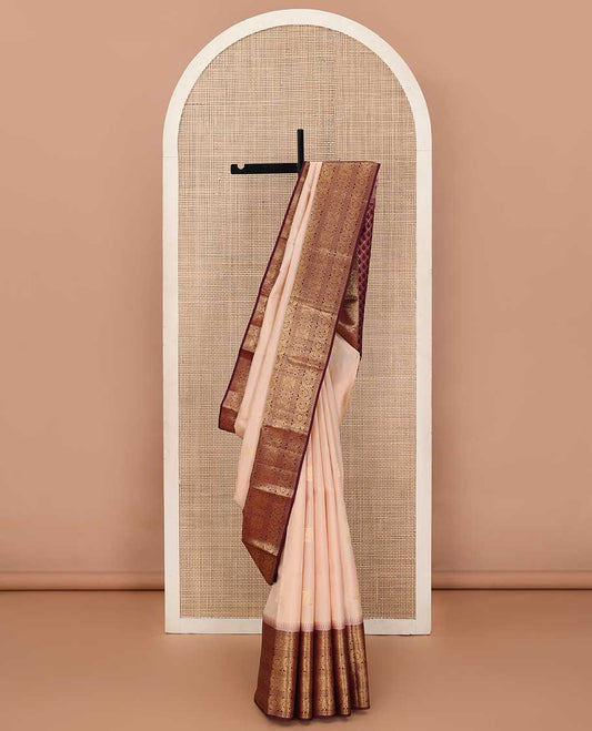 Sandal zari buttas silk saree, contrast border of ara bogudi, jadai nagam, and dhavana kodi, and spade motifs steeped pallu