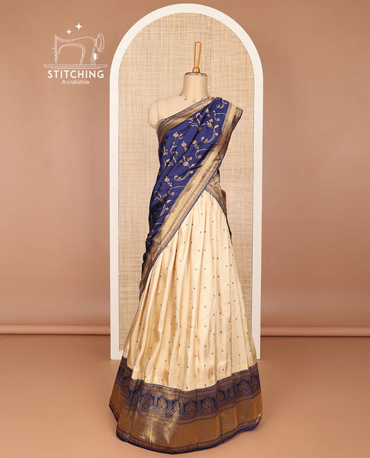 Cream buttas banaras half saree with contrast traditional zari design border, zari design blouse & dark blue floral vine design dhavani