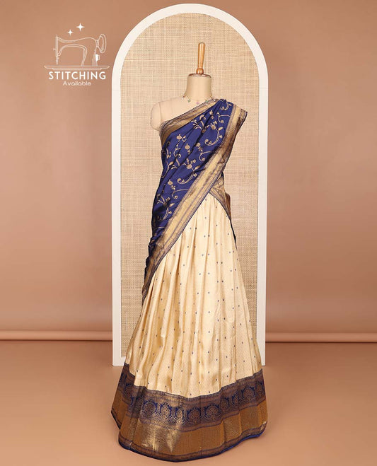 Cream buttas banaras half saree with contrast traditional zari design border, zari design blouse & dark blue floral vine design dhavani