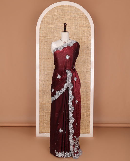 Maroon intricate path embroidered motifs featured designer saree, scallop gleaming stone embroidered border