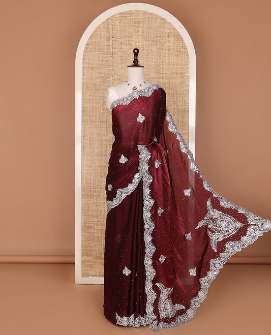 Maroon intricate path embroidered motifs featured designer saree, scallop gleaming stone embroidered border