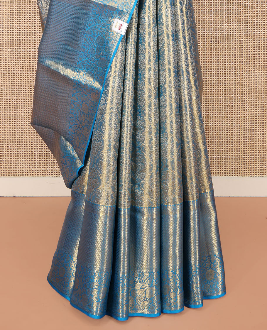 Blue Kanchipuram Silk Saree, Mesmerized with Zari Jacquard Design All Over Its Body, Highlighted by a Zari Border of Thilakam, Muthu, Kathir, Diamond, and Floral Designs, and Pallu of Jaal Designs, and Paired with a Matching Blouse
