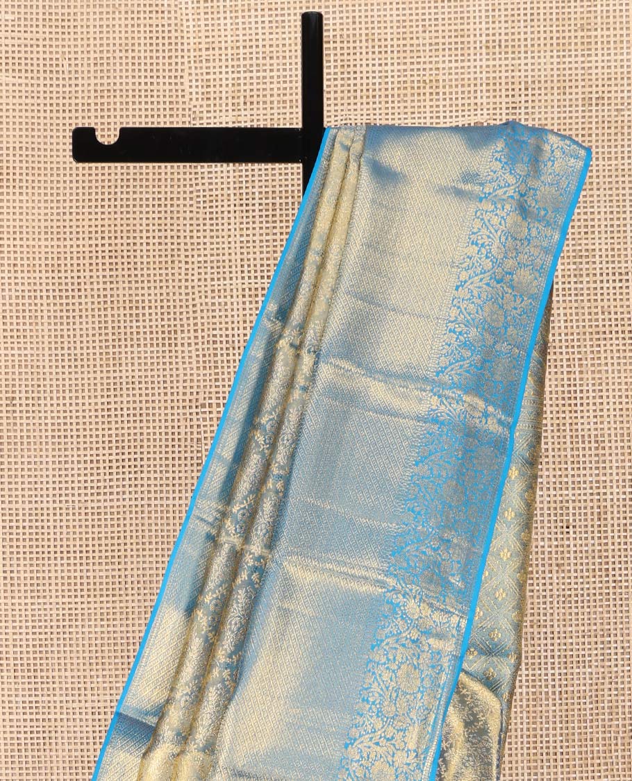 Blue Kanchipuram Silk Saree, Mesmerized with Zari Jacquard Design All Over Its Body, Highlighted by a Zari Border of Thilakam, Muthu, Kathir, Diamond, and Floral Designs, and Pallu of Jaal Designs, and Paired with a Matching Blouse