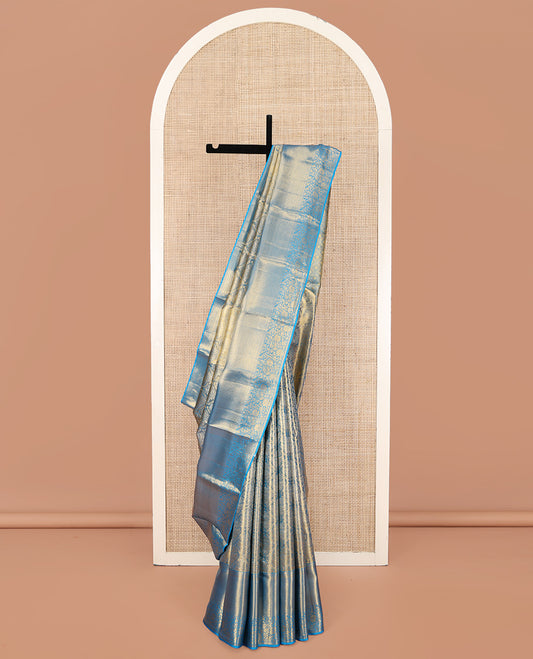 Blue Kanchipuram Silk Saree, Mesmerized with Zari Jacquard Design All Over Its Body, Highlighted by a Zari Border of Thilakam, Muthu, Kathir, Diamond, and Floral Designs, and Pallu of Jaal Designs, and Paired with a Matching Blouse