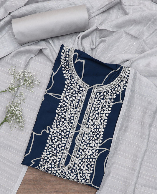 Blue material churidar set, floral printed and embroidered top, contrast plain bottom, and a sequins embroidered dupatta