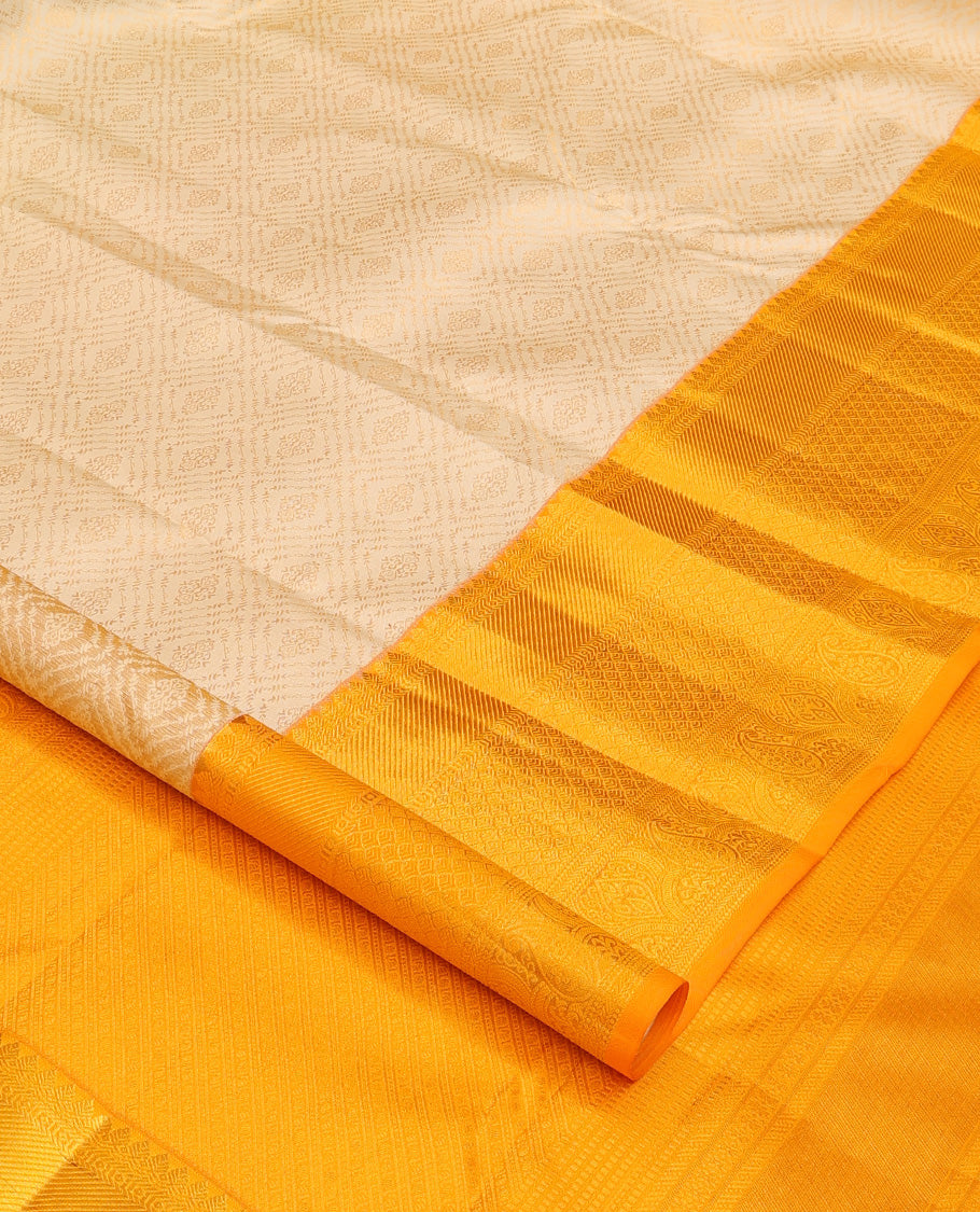 Cream jacquard wedding silk saree, contrast traditional zari design border, and intricate pallu