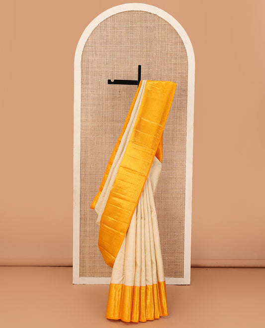 Cream jacquard wedding silk saree, contrast traditional zari design border, and intricate pallu