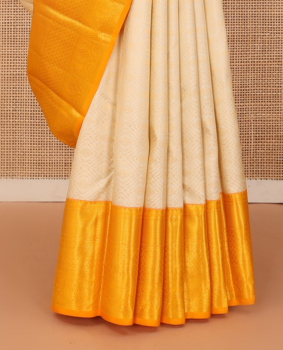 Cream jacquard wedding silk saree, contrast traditional zari design border, and intricate pallu