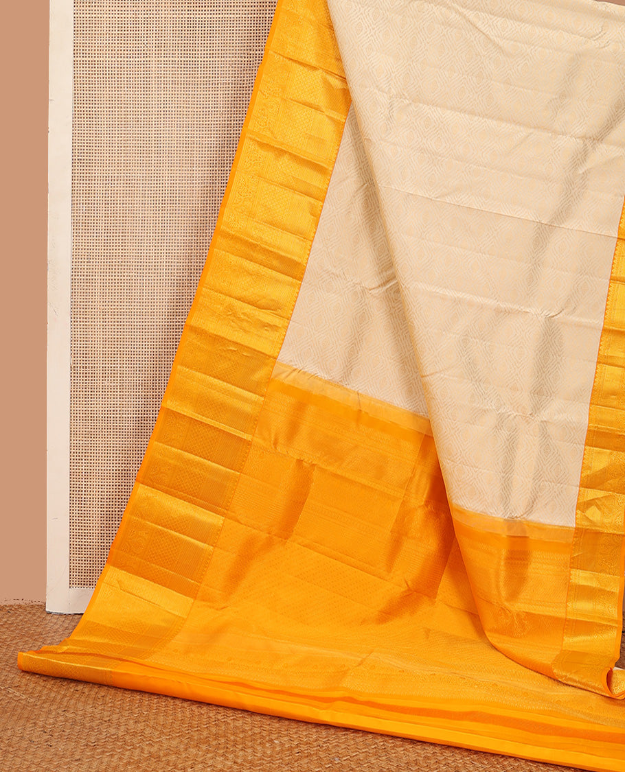 Cream jacquard wedding silk saree, contrast traditional zari design border, and intricate pallu