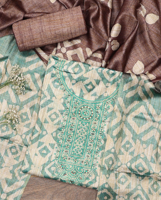 Green material chudidar set, batik style printed with neck embroidered top, contrast plain bottom, and batik printed dupatta