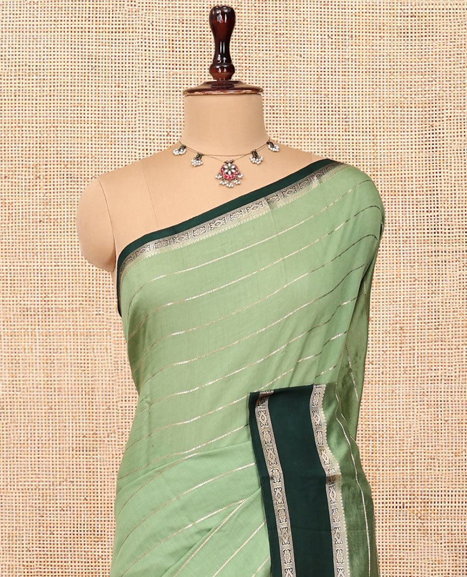 Green Assam Silk Saree, Elegantly Framed with Zari Stripes, Complemented by Contrast Traditional Zari Border, Striped Pallu, and a Contrast Blouse