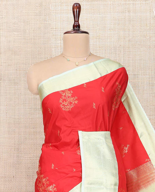 Red Budget Silk Saree, Charmingly Accented with Zari Buttas All Over Its Body, Complemented by a Contrast Traditional Zari Design Border of Paisleys, Majestically Zari Detailed Pallu, and Paired with a Contrast Blouse