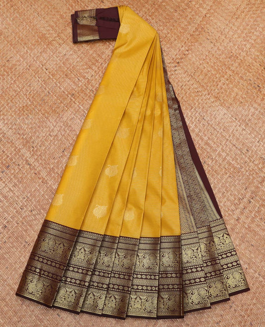 Yellow Budget Silk Saree, Subtly Sparkled With Zari Buttas and Stripes On Its Body, Complemented by Contrast Traditional Zari Designs Woven Border, Grand Pallu and Paired with a Contrast Blouse