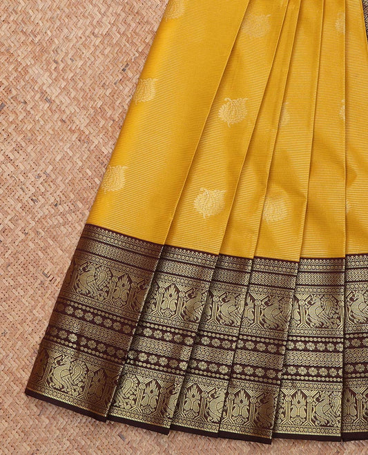 Yellow Budget Silk Saree, Subtly Sparkled With Zari Buttas and Stripes On Its Body, Complemented by Contrast Traditional Zari Designs Woven Border, Grand Pallu and Paired with a Contrast Blouse