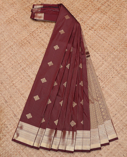 Maroon Budget Silk Saree, Gleamed Up with Diamond Buttas and Zari Stripes All Over Its Body, Highlighted by a Traditional Zari Design Border, Pallu of Jaal Design, and Paired with a Matching Blouse