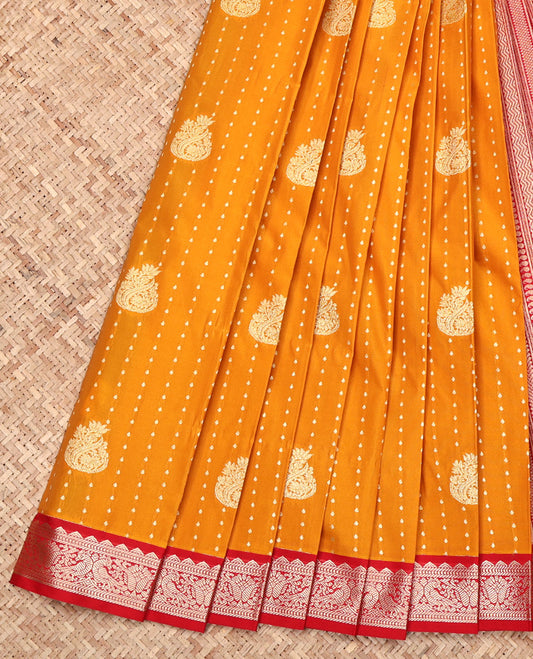 Orange Budget Silk Saree, Woven with Zari Buttas All Over Its Body, Complemented by a Contrast Peacock Zari Design Border, Geometric Patterned Pallu, and Paired with a Contrast Blouse