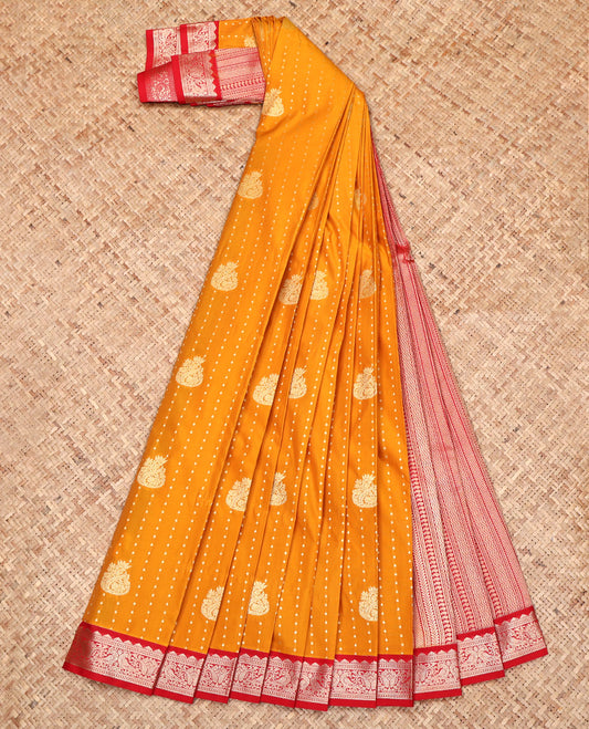 Orange Budget Silk Saree, Woven with Zari Buttas All Over Its Body, Complemented by a Contrast Peacock Zari Design Border, Geometric Patterned Pallu, and Paired with a Contrast Blouse