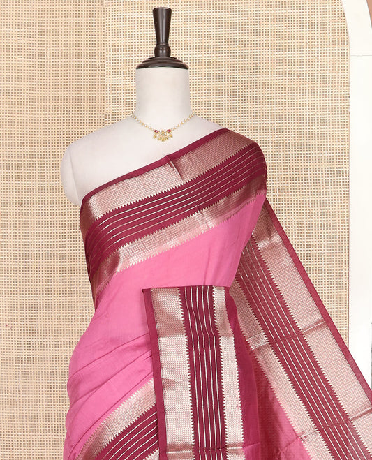 Pink plain assam silk saree, contrast traditional zari design border, and zari striped pallu