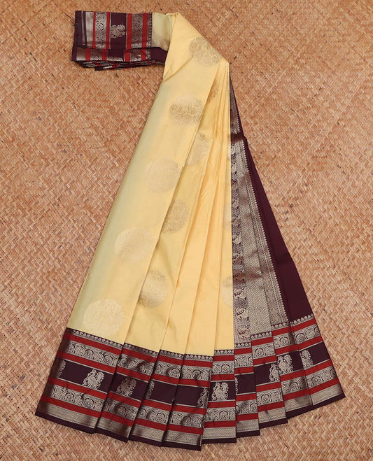 Yellow Budget Silk Saree, Sparsely Decked Up with Round Zari Buttas All Over Its Body, Complemented by Captivating Contrast Border of Traditional Zari Designs, Grand Jaal Pallu, and Paired with a Contrast Blouse