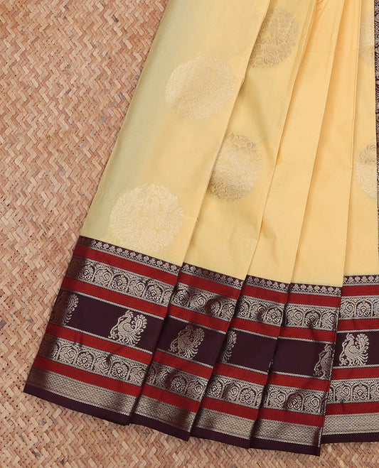 Yellow Budget Silk Saree, Sparsely Decked Up with Round Zari Buttas All Over Its Body, Complemented by Captivating Contrast Border of Traditional Zari Designs, Grand Jaal Pallu, and Paired with a Contrast Blouse