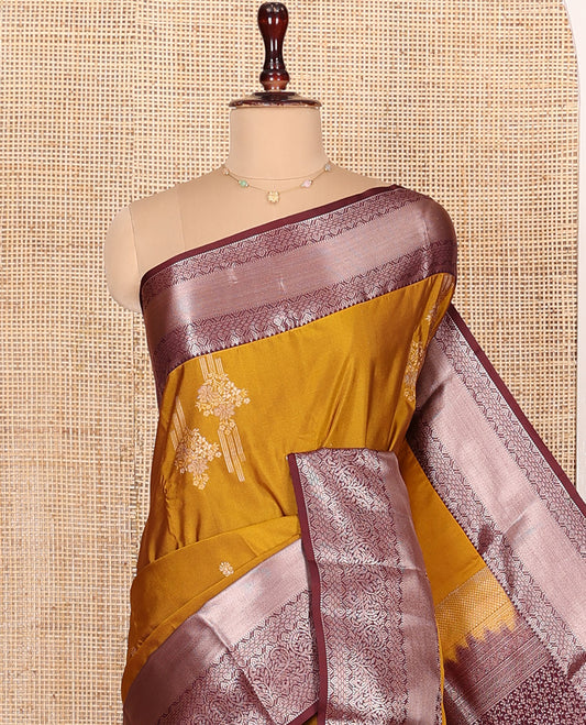 Orange Budget Silk Saree, Decked Up with Zari Buttas All Over Its Body, Complemented by a Contrast Border of Traditional Designs Woven in Zari, Opulently Embellished Pallu, and Paired with a Contrast Blouse