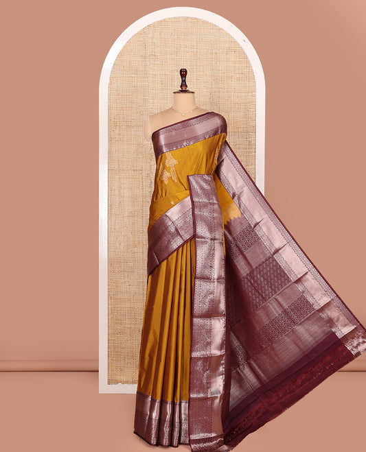Orange Budget Silk Saree, Decked Up with Zari Buttas All Over Its Body, Complemented by a Contrast Border of Traditional Designs Woven in Zari, Opulently Embellished Pallu, and Paired with a Contrast Blouse