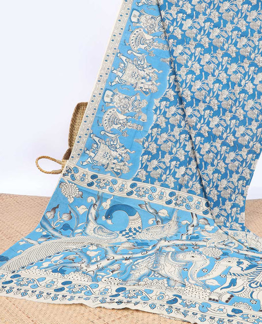 Blue floral machine-printed kalamkari cotton saree, contrast human motifs border & pallu of animal motifs