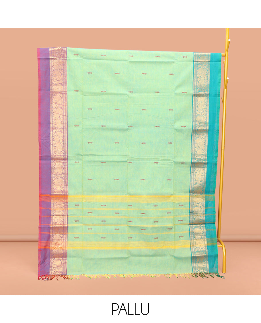 Green Chettinad Cotton Saree, Delicately Woven with Thread Buttas All Over Its Body, Complemented by a Contrast Ganga-Jamuna Kal Eragina Border of Kodi Peacock and Elephant Designs, Pallu of Buttas and Stripes, and Paired with a Matching Blouse