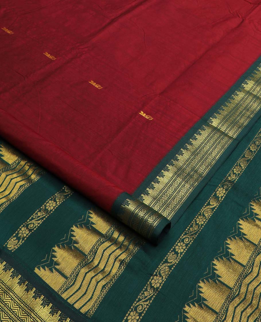 Maroon buttas nine-yard cotton saree, contrast traditional zari border, and pallu steeped with traditional motifs