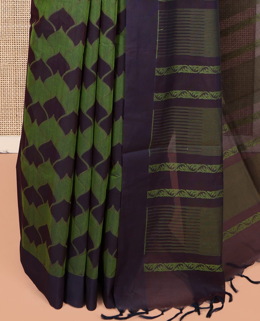 Green Coimbatore Cotton Saree, Ornamented with Scallop Design on Its Body, a Contrast Plain Border, Pallu of Floral Creeper, and Stripes, and Paired with Contrast Blouse