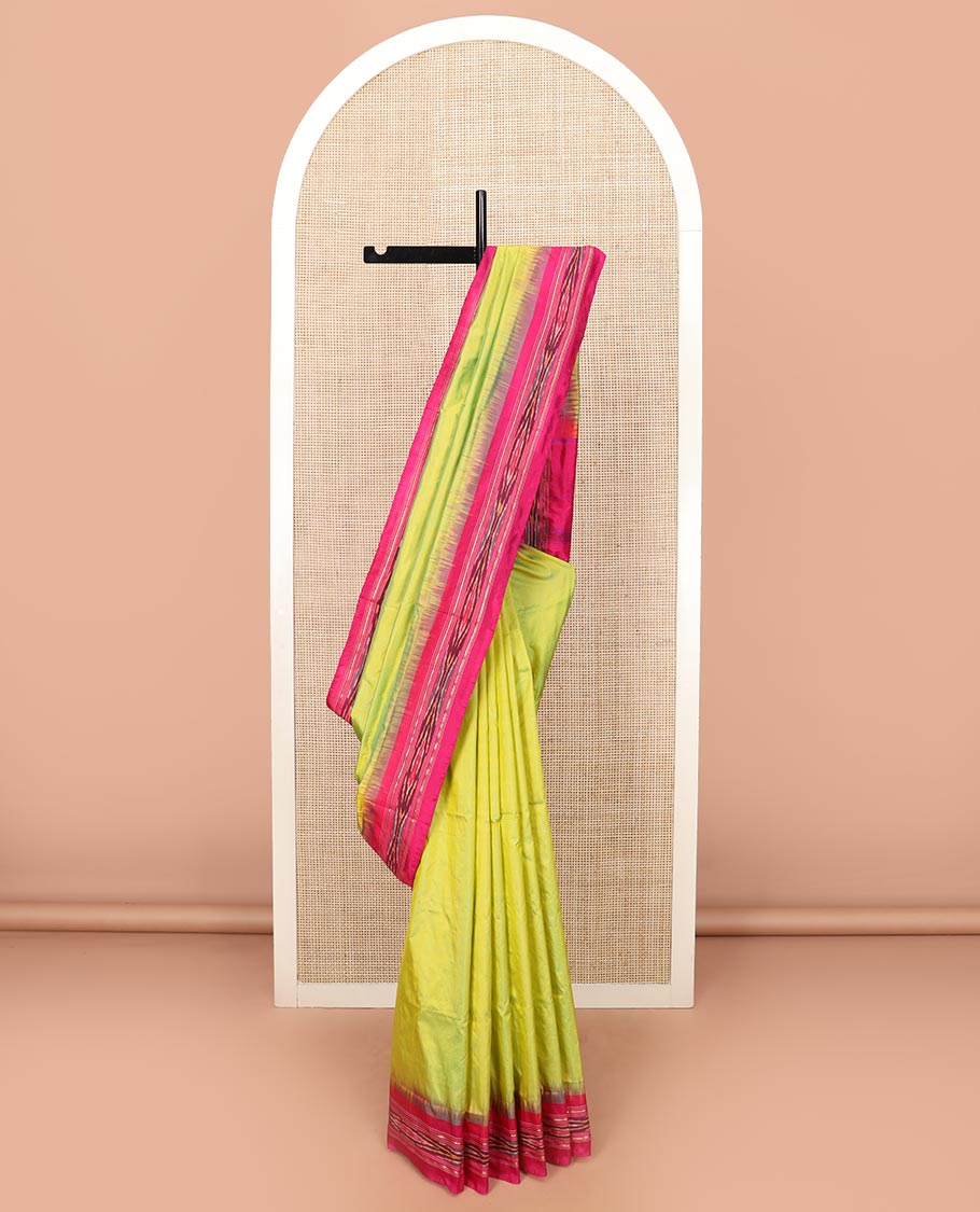 Green Plain Ikkat Silk Saree with a Contrast Rani Pink Border Accentuated by a Hazy Ikkat Weave, Featuring a Pallu Flanked by Stripes and Ikkat Texture