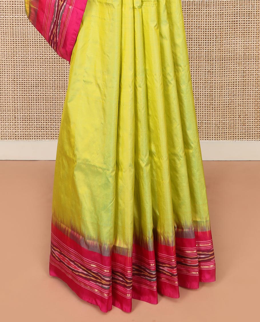 Green Plain Ikkat Silk Saree with a Contrast Rani Pink Border Accentuated by a Hazy Ikkat Weave, Featuring a Pallu Flanked by Stripes and Ikkat Texture
