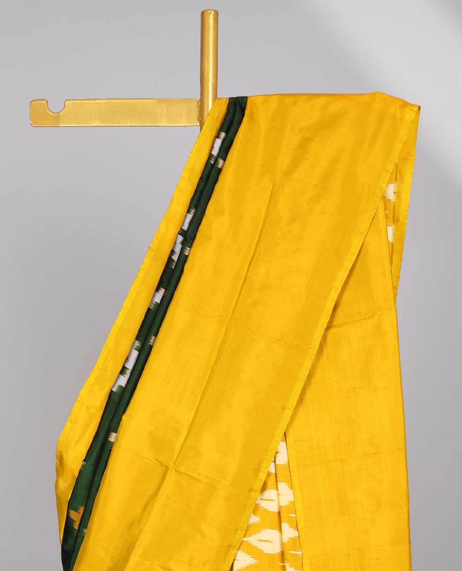 Green striped ikkat silk saree with contrast zari border & ogee design pallu