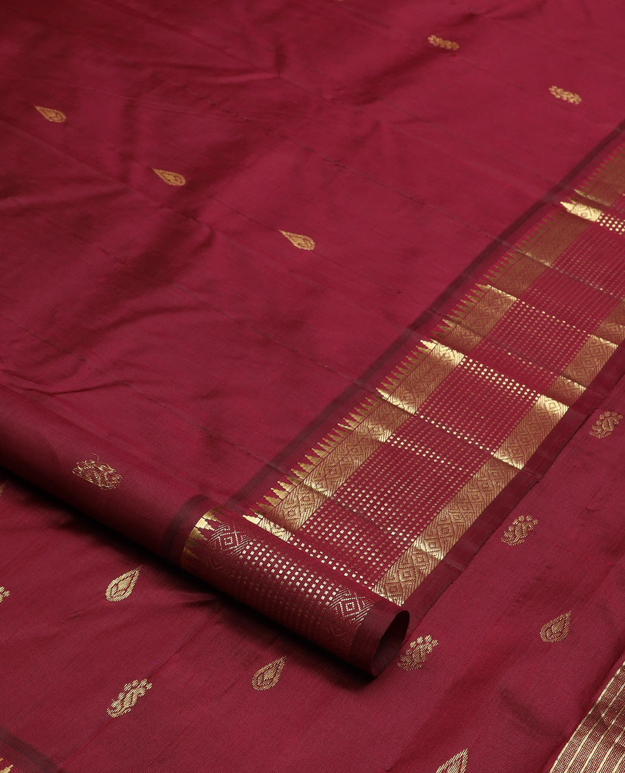 Maroon zari buttas Kanchipuram silk saree, one-sided zari border of thazampoo rekku, banaras, diamond, and muthu stripes, and zari design pallu