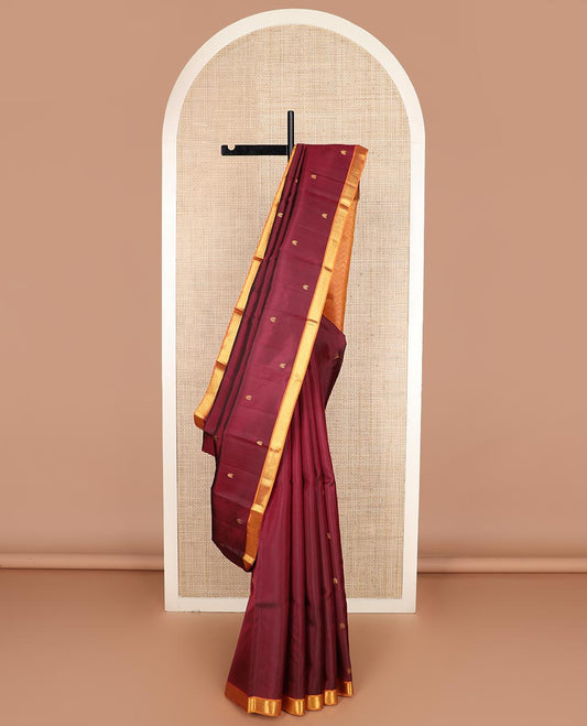 Maroon zari buttas Kanchipuram silk saree, contrast border of rekku, and muthu designs, and chevron design pallu