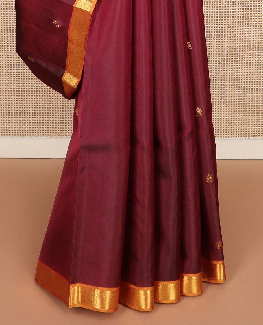 Maroon zari buttas Kanchipuram silk saree, contrast border of rekku, and muthu designs, and chevron design pallu