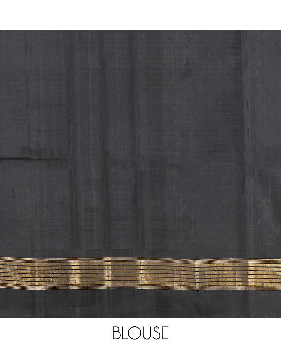 Yellow zari buttas Kanchipuram silk saree, contrast thazampoo rekku zari border, and pallu features kamalam designs
