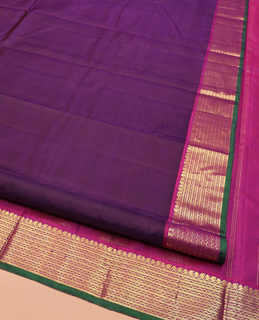 Purple Plain Kanchipuram Silk Saree, Complemented by Contrast Border Featuring Thilakam Mokku, Manga Mokku, Banaras, and Neli Designs, Pallu Adorned with Zari Designs, and Paired with a Contrast Blouse
