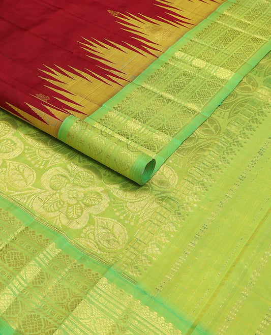 Red kancheepuram silk saree with zari buttas, contrast one-sided thazampoo reku border of salngai,banaras,kattu thuthirippu & laddu kamalam & floral design pallu