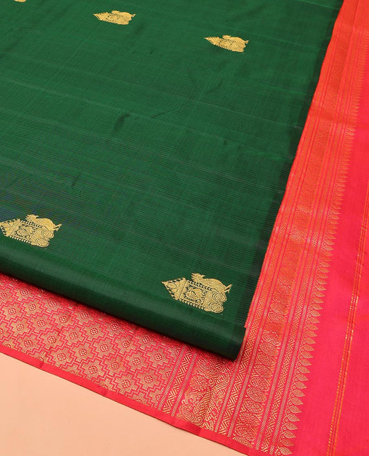 Borderless Green Kanchipuram Silk Saree, Bedecked with Mayil Buttas All Over Its Body, Complemented by a Contrast Pallu of Intricate Designs, and Paired with a Contrast Blouse
